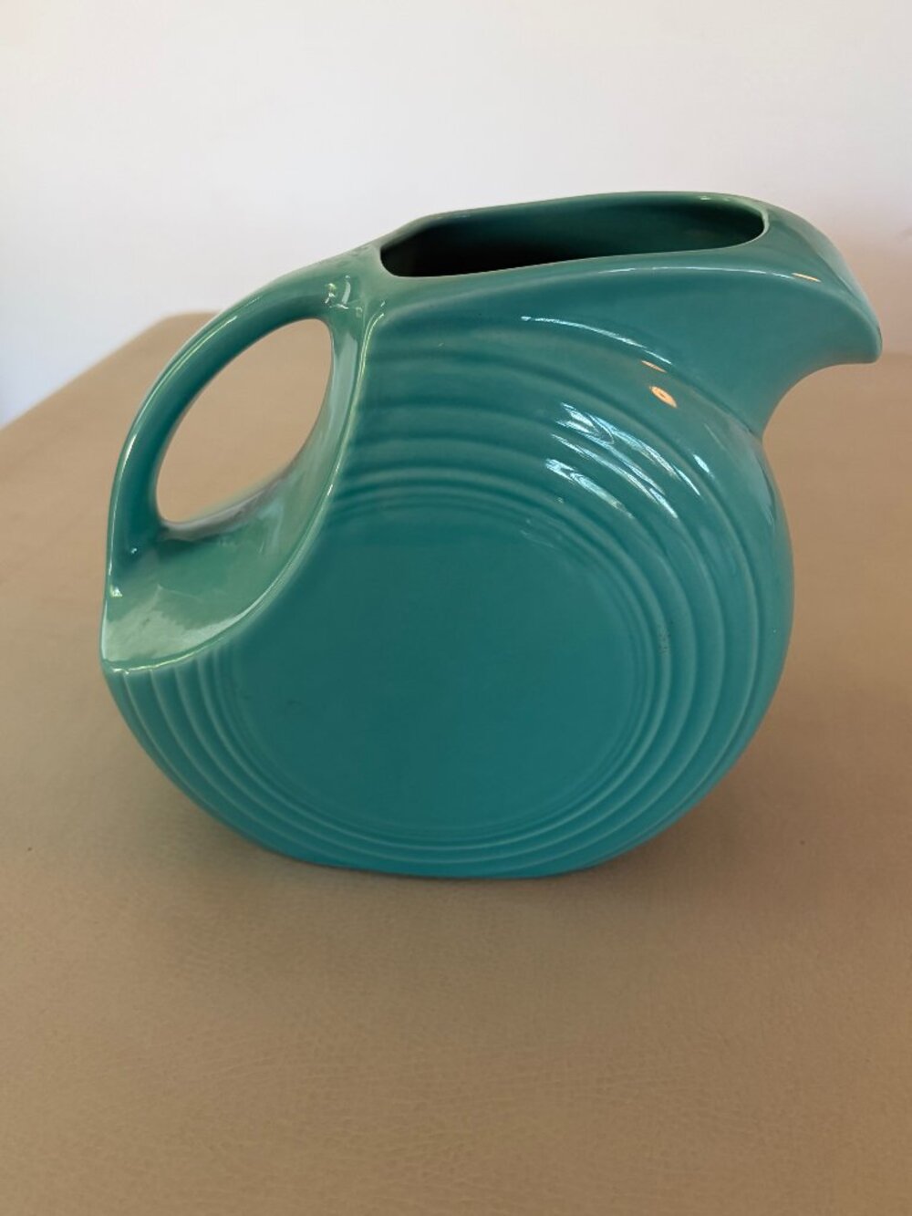 Fiesta / Homer Laughlin turquoise ceramic pitcher, likely contemporary/reissue